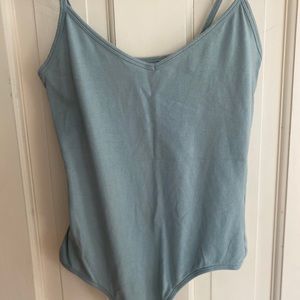 Light green body suit.